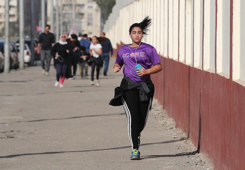 A young Egyptian woman is jogging near the compound of the military academy in Cairo, Egypt.  EPA