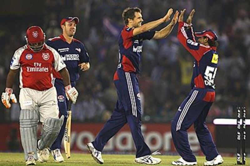 The Delhi Daredevils' Dirk Nannes, centre, celebrates the wicket of Ramesh Powar.