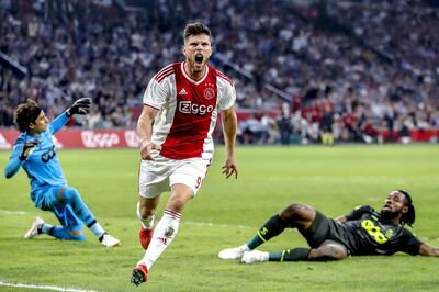 Ajax's forward Klaas Jan Huntelaar (C) celebrates his 1-0 goal against Standard Liege during the UEFA Champions League qualifying third round match at the Johan Cruijff ArenA in Amsterdam, on August 14, 2018. (Photo by Stanley Gontha / ANP / AFP) / Netherlands OUT