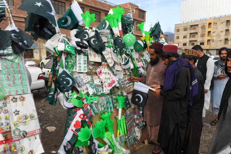 Customers buy memorabilia at a market stall in Quetta, Balochistan. AFP