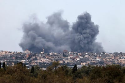 Smoke rises into the sky above Khan Younis after Israel bombs were dropped in the southern Gaza Strip. AFP