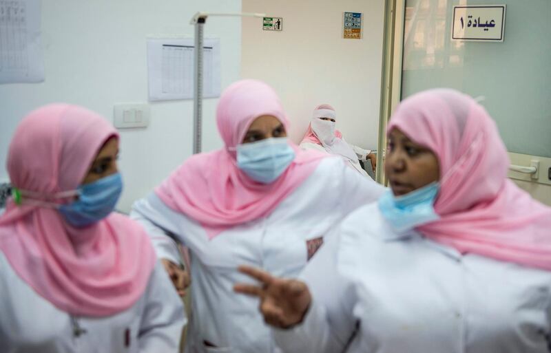 Nurses wait for volunteers for a vaccine trial in Cairo, Egypt. EPA