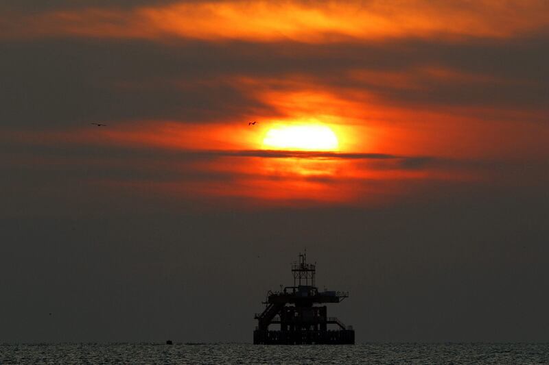 Brent crude fell below US$50 on Thursday for the first time since late March but gained back some ground on Friday to close at $49.10. Above, a floating oil platform along the Tirreno sea coast north of Rome. Giampiero Sposito / Reuters
