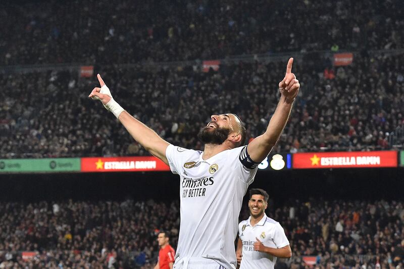 Real Madrid's Karim Benzema celebrates after completing his hat-trick  in the Copa del Rey semi-final second leg win at Barcelona  on April 5, 2023. AFP