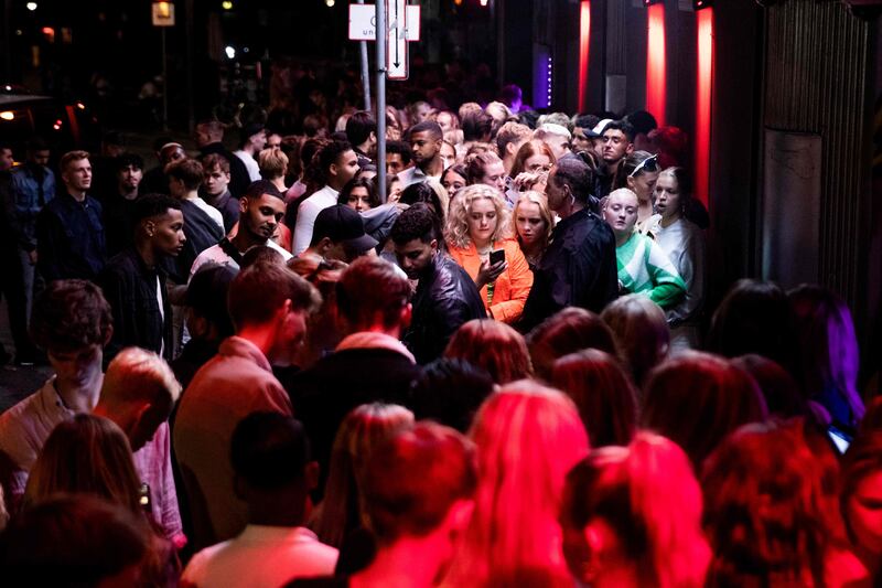 Crowds outside a club in Copenhagen. Denmark is removing its last Covid-19 restriction as cases continue to fall. AFP