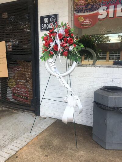 A wreath laid at the scene of the murder. Photo: Randi Hildreth / WSFA/WDFX