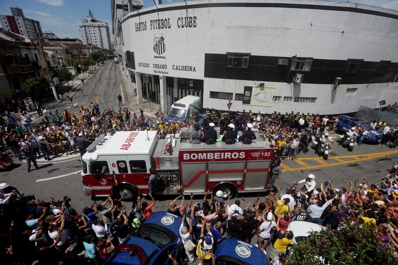 Fans gather to bid Pele farewell on Tuesday. Reuters