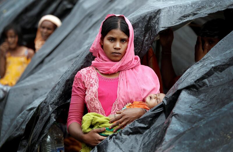 Rohingya refugees wait in a camp in Cox's Bazar, Bangladesh. Cathal McNaughton / Reuters