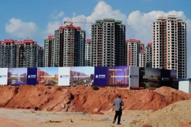 In places such as Ordos in Inner Mongolia, hundreds of projects similar to this one have ground to a halt after over-investment that fuelled a building boom has gone bust. Mark Ralston / AFP