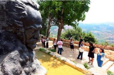 A statue of the Lebanese poet and artist Khalil Gibran stands outside his house in the town of Bsharri. AFP