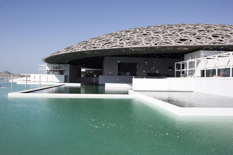 After a construction process that has taken seven years, the Louvre Abu Dhabi is now surrounded by the waters of the Arabian Gulf. Christopher Pike / The National