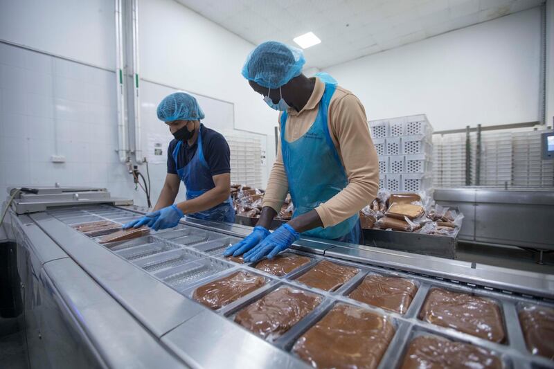 Dubai, United Arab Emirates - Workers at packaging area at Al Barakah Dates Factory, Dubai Industrial City.  Leslie Pableo for The National