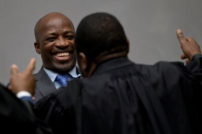 Charles Ble Goude, former head of Ivory Coast Young Patriots hugs a member of his legal team as he and former Ivory Coast President Laurent Gbagbo enter the courtroom of the International Criminal Court in The Hague, Netherlands, Netherlands January 15, 2019. Peter Dejong/Pool via REUTERS