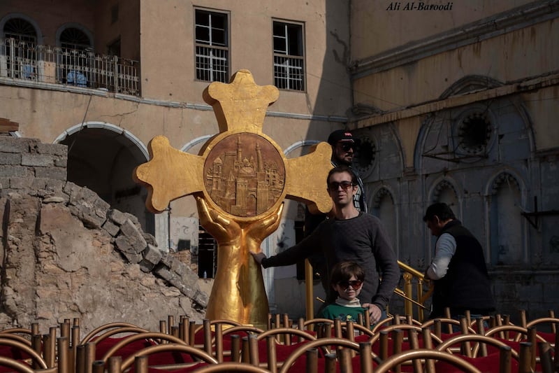 Omar stayed under ISIS. He was making statues in the basement of his house. After ISIS, his works filled public squares and art galleries. Today, he was strongly present to install the cross which contained all the civilizations of this land. This is taken taken in Mosul’s Old Town, in Church Square where Pope Francis will hold a prayer. Courtesy Ali Y. Al-Baroodi