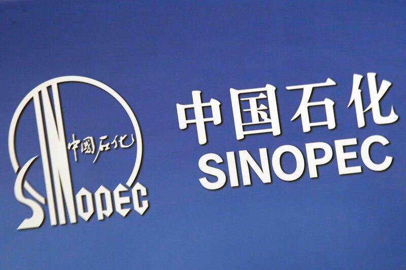 FILE PHOTO: The company logo of China's Sinopec Corp is displayed at a news conference in Hong Kong, China March 26, 2018. REUTERS/Bobby Yip /File Photo