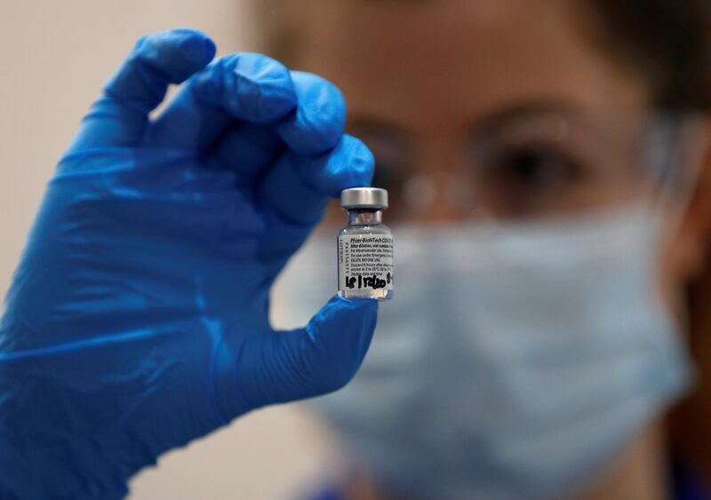 A nurse holds a phial of the Pfizer-BioNTech Covid-19 vaccine at Guy's Hospital in London. Reuters