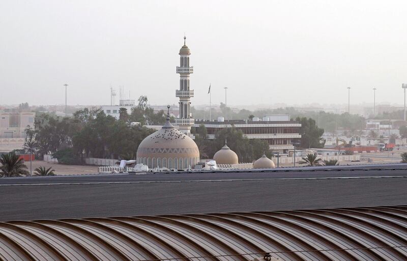 Abu Dhabi, United Arab Emirates, October 5, 2019.   -- 
Hazy weather at Abu Dhabi.  Shot from ADNEC.  --  Workers do regular maintainance at the ADNEC roof tops.
Victor Besa / The National
Section:  NA
Reporter: