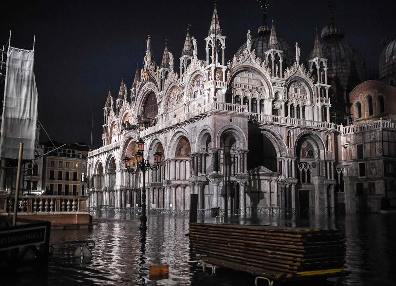 The flooded Piazza San Marco square, with the San Marco Basilica. AFP