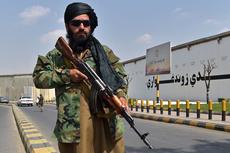 A Taliban fighter stands guard near Zanbaq Square in Kabul. AFP