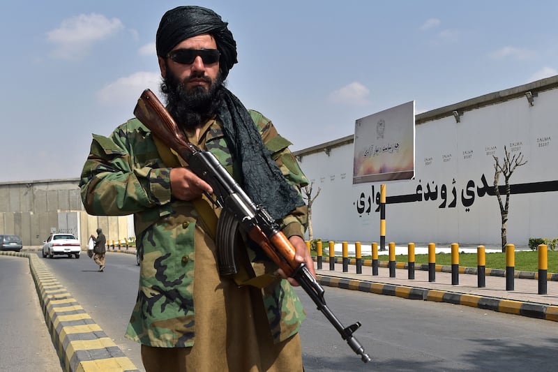 A Taliban fighter stands guard near Zanbaq Square in Kabul. AFP