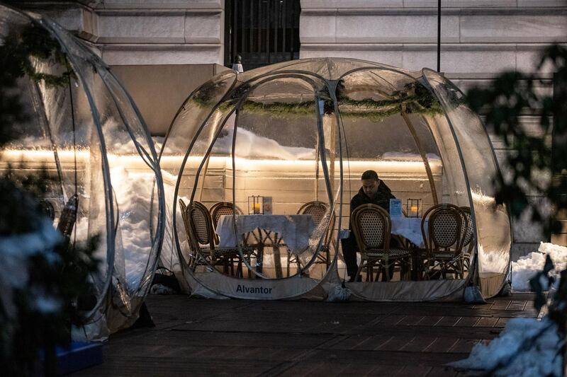 A man sits in a bubble tent in New York City, New York, USA. Reuters