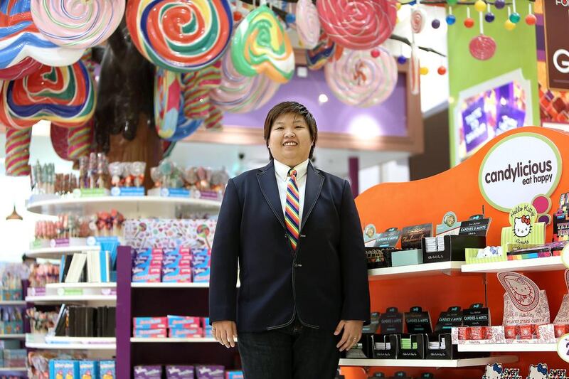 Kriz Huang, cluster manager at the Candylicious store in Dubai Mall, left Singapore in her desire to work abroad. Pawan Singh / The National