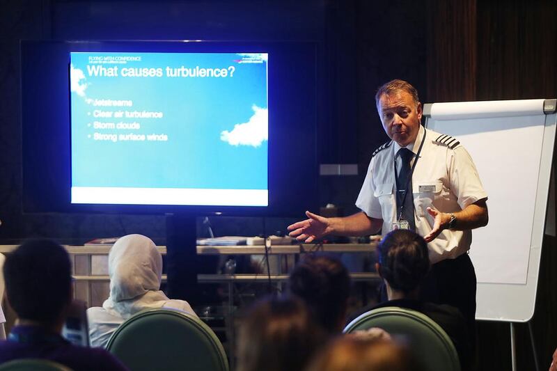 BA’s Captain Steve Allright tells his students they can conquer their fears with simple techniques during the Flying with Confidence course in the Capital Club, Dubai. Satish Kumar / The National