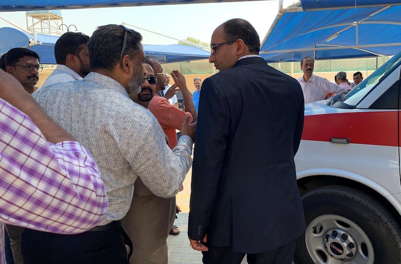 DUBAI ,  UNITED ARAB EMIRATES , JUNE 08 – 2019 :- Vipul , Consul General of India in Dubai ( in black suit ) helping relatives and friends of the Seventeen people who were died in the bus crashed on Thursday evening at the Sonapur Embalming Centre in Dubai. Indian Consulate officials and social workers are helping to shift their dead bodies at the airport and do the necessary paper work.  ( Pawan Singh / The National ) For News/Online/Instagram