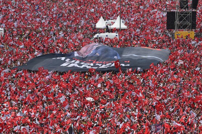 ISTANBUL, TURKEY - JUNE 23: Thousands of supporters wave flags and cheer as they listen during an election rally for Muharrem Ince, presidential candidate of Turkey's main opposition Republican People's Party (CHP) on June 23, 2018 in Istanbul, Turkey. Presidential candidates from all parties are holding campaign rallies across Turkey a day ahead of the June 24, parliamentary and presidential elections. Muharrem Ince is one of six candidates contesting the snap elections called by Turkey's President Recep Tayyip Erdogan. More than 59 million citizens will vote for presidential and parliamentary elections tomorrow.The election will decide the faith of Erdogan's 16-year dominance in Turkish politics.  (Photo by Burak Kara/Getty Images)