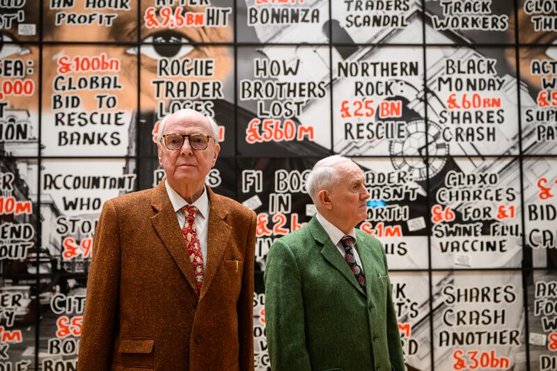 Gilbert Prousch, right, and George Passmore, otherwise known as Gilbert & George, at a press preview of their latest exhibition 'London Pictures'. Getty Images