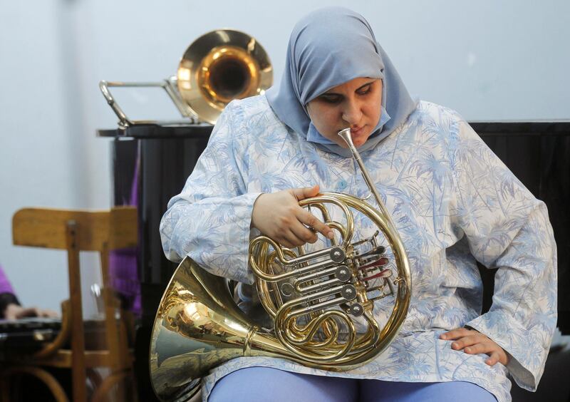 A member of Al Nour Wal Amal (Light and Hope) chamber orchestra chamber orchestra for blind women plays during a practice session in Cairo, Egypt. Reuters