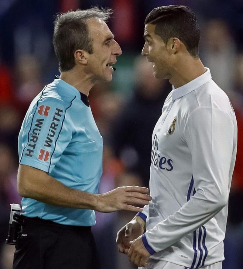 Real Madrid’s Portuguese striker Cristiano Ronaldo, right, argues with referee David Fernandez Borbalan. Emilio Naranjo / EPA