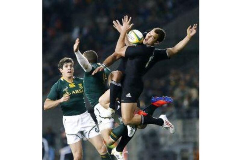 New Zealand's Israel Dagg, right, wins a tussle for a high ball against South Africa.