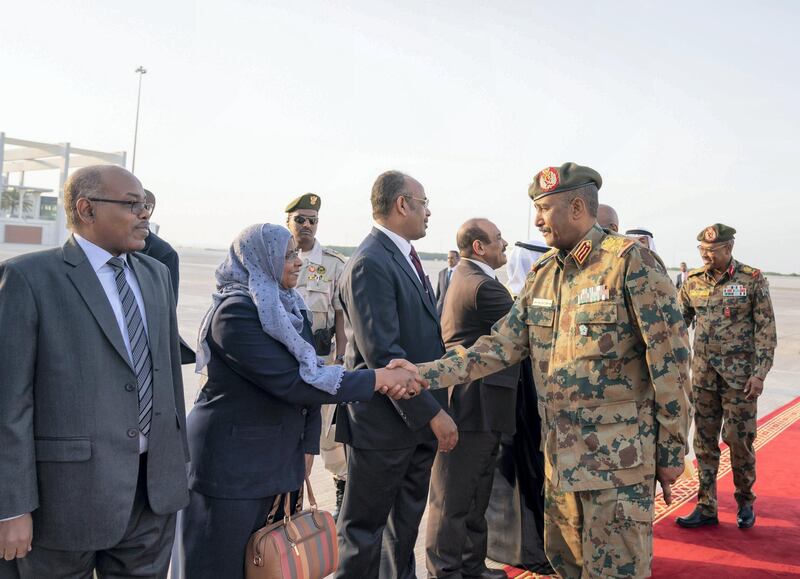 ABU DHABI, UNITED ARAB EMIRATES - May 26, 2019: Lieutenant General Abdel Fattah Al Burhan Abdelrahman, Head of transitional military council of Sudan (R) greets a dignitary, upon his arrival at the Presidential Airport.
( Mohamed Al Hammadi / Ministry of Presidential Affairs )
---