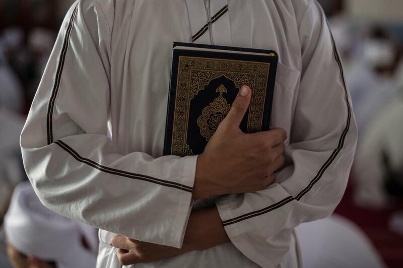 A Malaysian religious student holds the Quran at school during the Muslim holy fasting month of Ramadan in Hulu Langat, near Kuala Lumpur. Mohd Rasfan/AFP Photo