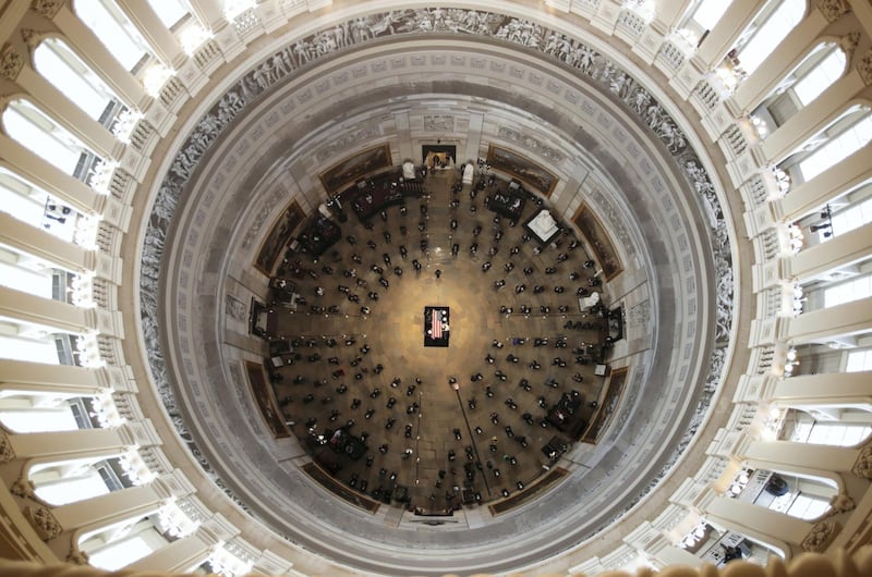 The casket of civil rights pioneer and longtime U.S. Representative John Lewis (D-GA), who died July 17, is placed by a U.S. military honor guard at the center of the U.S. Capitol Rotunda to lie in state in Washington, U.S., July 27, 2020. REUTERS/Jonathan Ernst/Pool     TPX IMAGES OF THE DAY