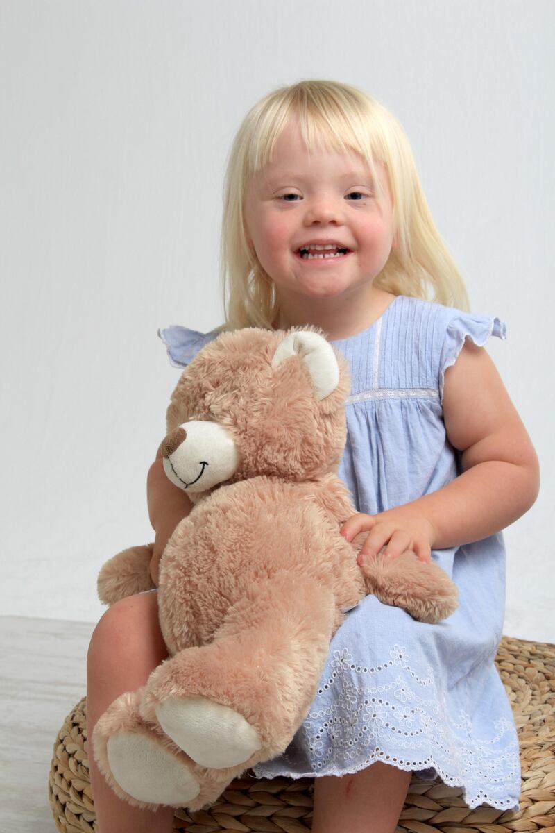 Tallulah Davis, poses with a teddy bear. Courtesy Carl Vincent