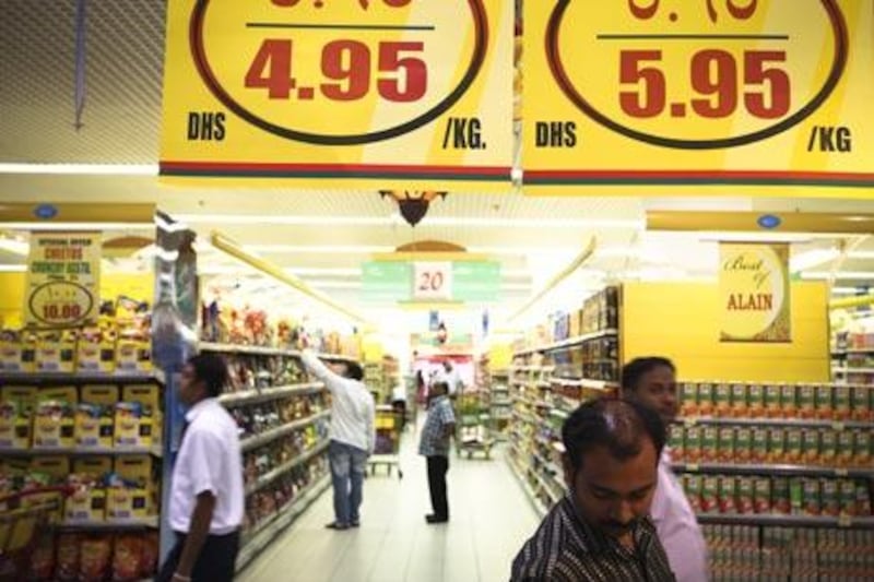 ABU DHABI, UNITED ARAB EMIRATES -- August 10, 2010 -- People shop for groceries and food at a store in Abu Dhabi. Lee Hoagland / The National