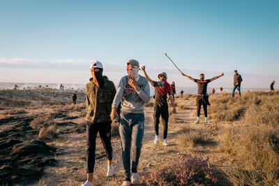 Young protesters regroup across from the Agareb landfill after being driven back by tear gas on Wednesday. Photo: Erin Clare Brown / The National