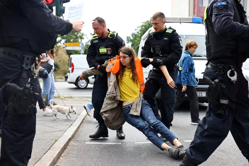 Activists from the Last Generation movement are known for attaching themselves to roads in traffic-blocking protests in Germany. Reuters