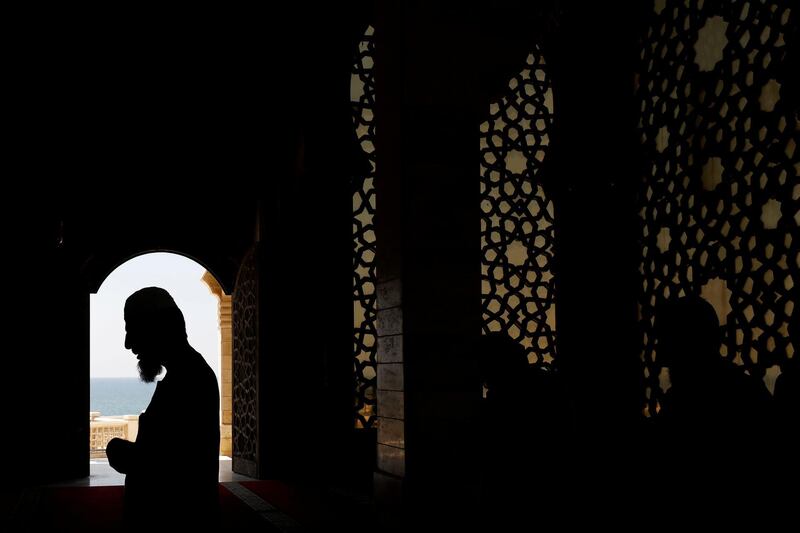 Palestinian members of staff pray in an almost empty mosque in the northern Gaza Strip. Reuters