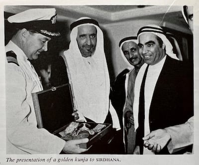 Sheikh Rashid bin Saeed presenting the ceremonial dagger to Captain Cunningham of the Sirdhana in 1970. Photo: P&O Heritage / DP World