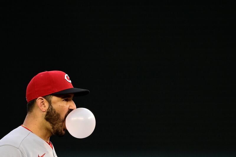 Cincinnati Reds third baseman Eugenio Suarez blows a bubble while standing in the field during the MLB game against the Washington Nationals at Nationals Park on Wednesday, May 26. Reuters