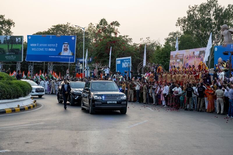 A motorcade carries Sheikh Mohamed and Mr Modi in Gujarat
