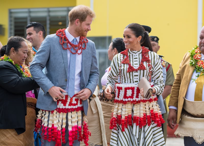 Prince Harry and Meghan visit an exhibition of Tongan handicrafts at the Fa'onelua Convention Centre in October 2018 in Nuku'alofa, Tonga. Getty