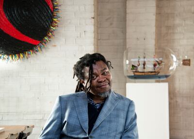 Yinka Shonibare was made a Commander of the British Empire in 2019. His ironic rendition of HMS Victory sits over his left shoulder. Photo by Marcus Leith