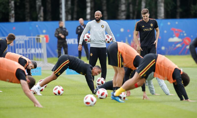 Belgium assistant coach Thierry Henry, center, looks on during a training session on the eve of the semifinal against France at the 2018 soccer World Cup in Moscow, Russia, Monday, July 9, 2018. (AP Photo/Alexander Zemlianichenko)