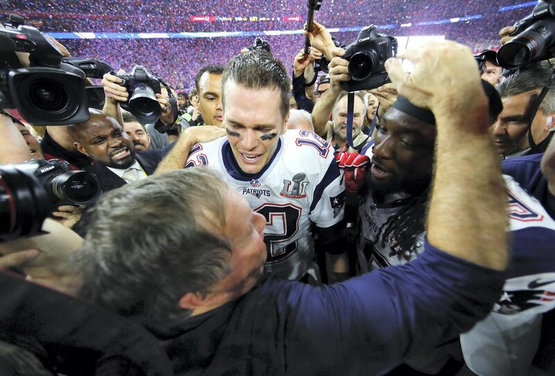 HOUSTON, TX - FEBRUARY 05:  Head coach Bill Belichick, Tom Brady #12 and LeGarrette Blount #29 of the New England Patriots celebrate after defeating the Atlanta Falcons during Super Bowl 51 at NRG Stadium on February 5, 2017 in Houston, Texas. The Patriots defeated the Falcons 34-28.  (Photo by Kevin C. Cox/Getty Images)
