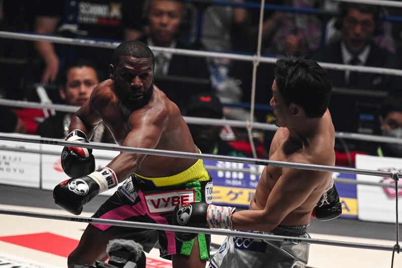 Floyd Mayweather lands a blow on Japanese mixed martial artist Mikuru Asakura during their exhibition boxing match at the Saitama Super Arena in Saitama on September 25, 2022. AFP