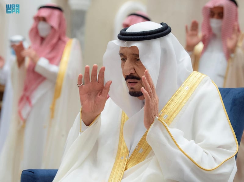 Saudi's King Salman performs prayers for Eid al-Fitr. SPA